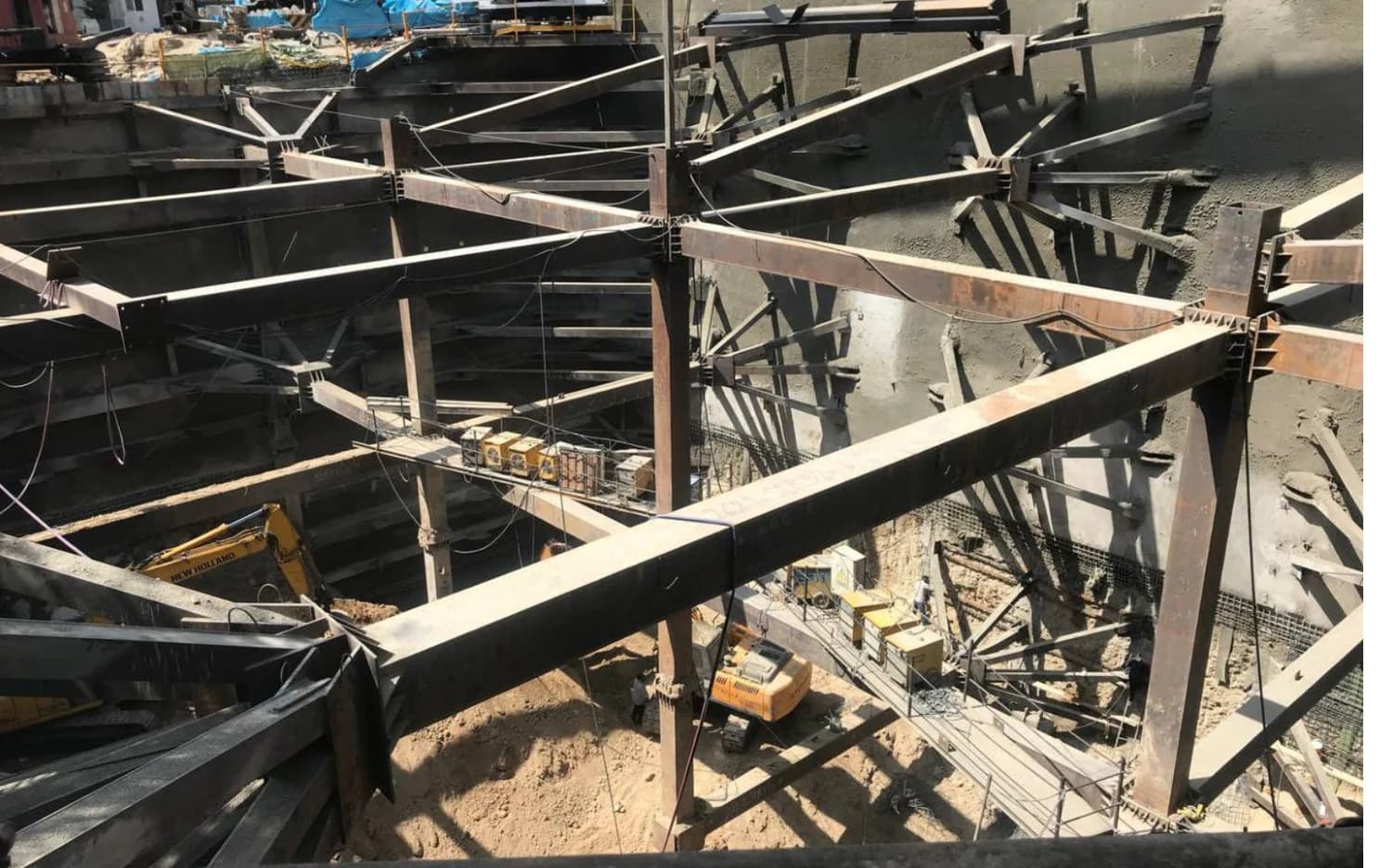 Sanitized field photograph of multi-level internal bracing in a deep excavation